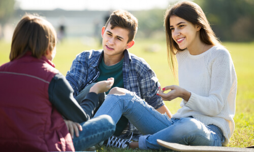 teenagers at the park talking