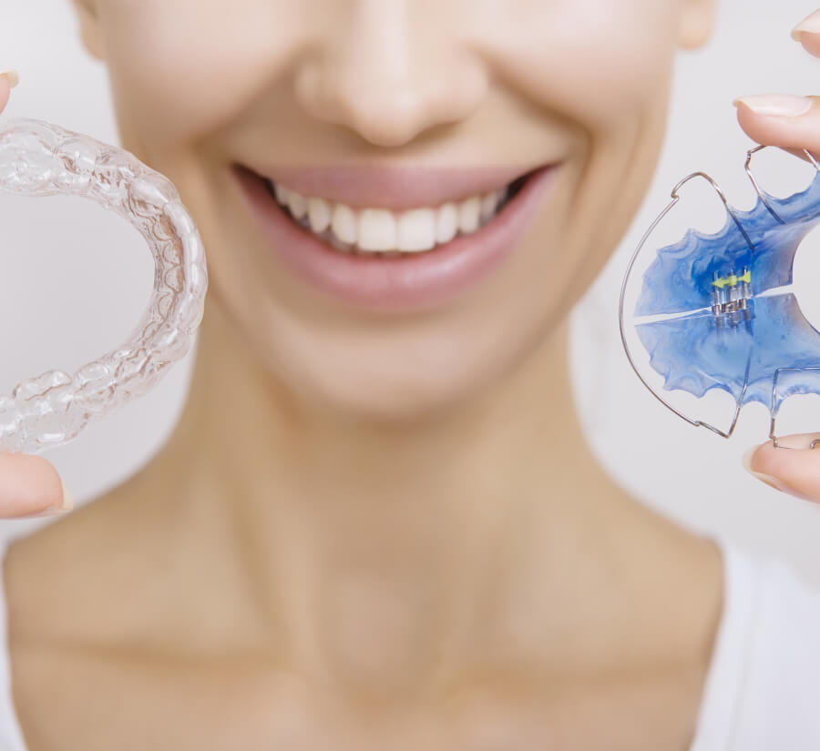 woman holding retainers