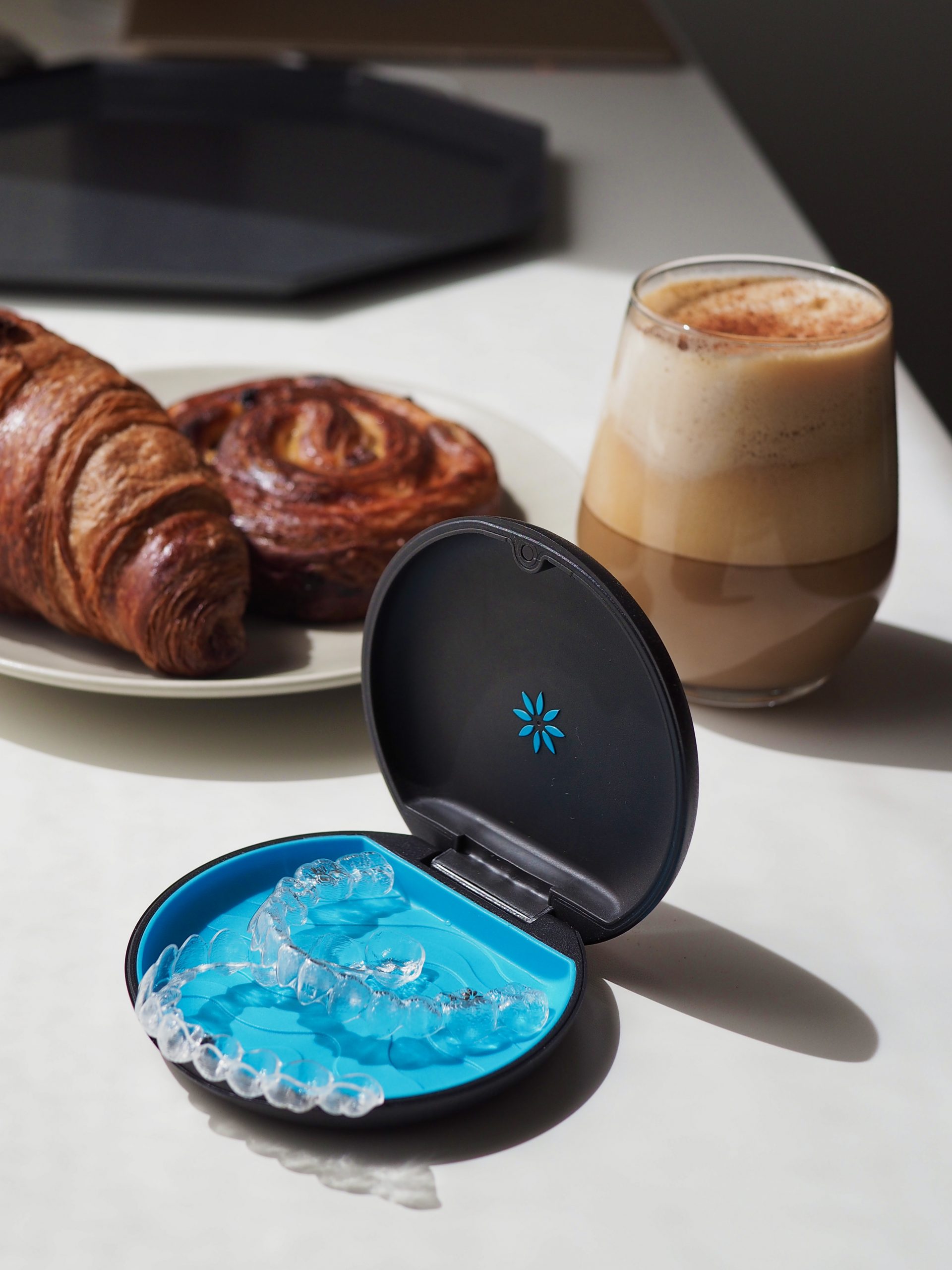 Invisalign with pastries and coffee in the background