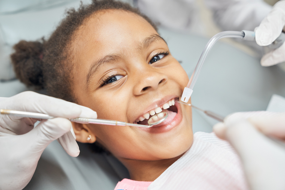 young girl in dental chair